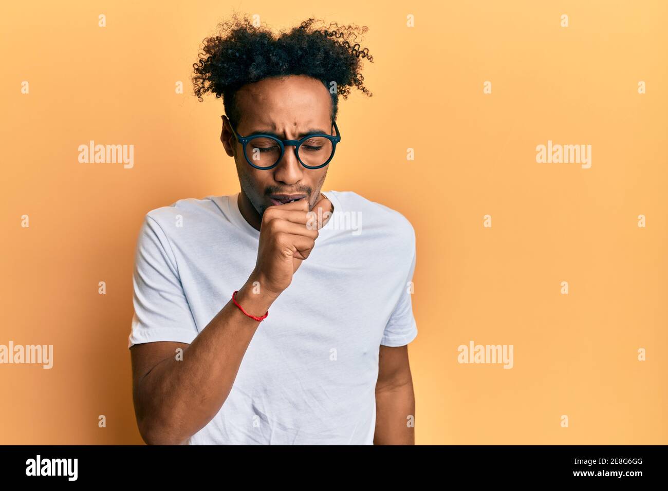 Young african american man with beard wearing casual white t shirt and ...
