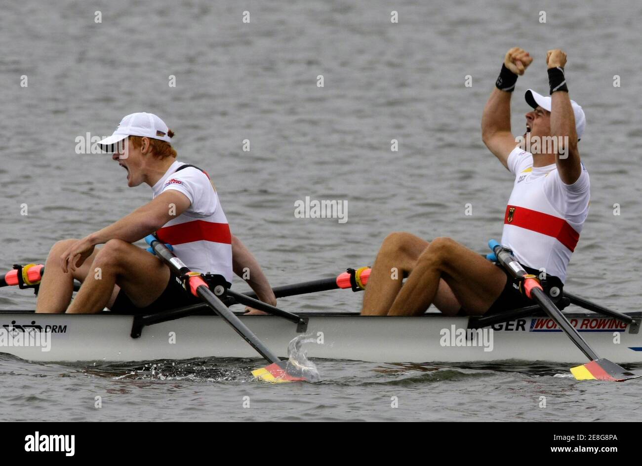 Eric Knittel and Stephan Krueger (R) of Germany celebrate after winning in the men's double sculls final during the World Rowing Championships in Poznan August 29, 2009. REUTERS/Peter Andrews (POLAND S SPORT ROWING) Stock Photo