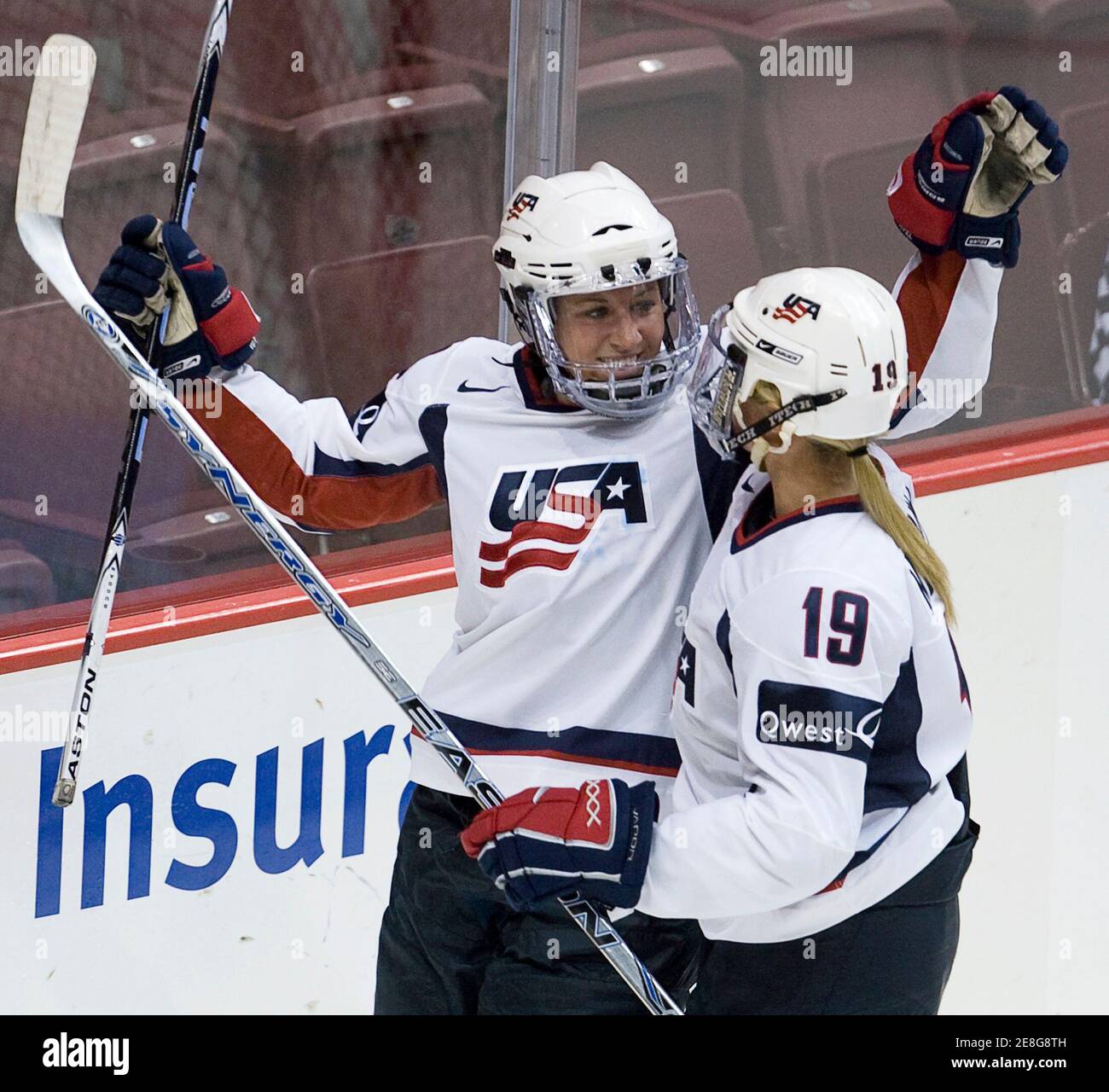 USA's Meghan Duggan (L) celebrates her goal against Finland with team mate Gigi Marvin during the first period of their semi-final Hockey Canada Cup game in Vancouver, British Columbia September 5, 2009. The IIHF exhibition tournament, which includes the top four women's teams from Canada, Sweden, Finland and the USA, is a test event for the upcoming 2010 Olympics.        REUTERS/Andy Clark     (CANADA SPORT ICE HOCKEY) Stock Photo