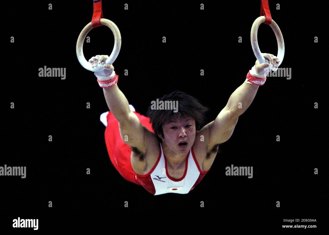 Kohei Uchimura from Japan performs his routine on the rings during the qualifying round of the the Gymnastics World Championships at the O2 Arena in London October 13, 2009. REUTERS/Jerry Lampen (BRITAIN SPORT GYMNASTICS) Stock Photo