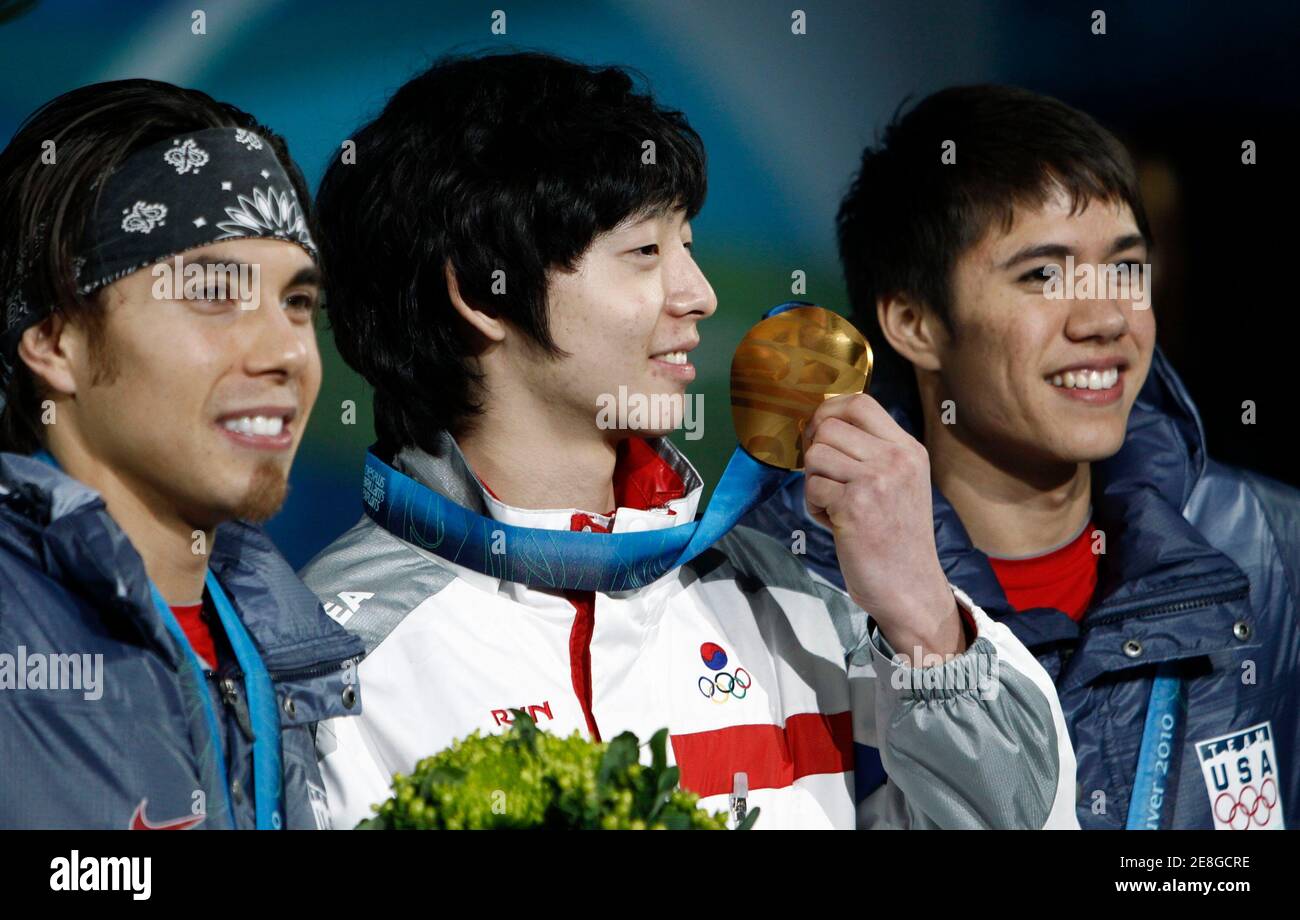 Gold medallist Lee Jung-su (C) of South Korea holds his medal beside silver medallist Apolo Anton Ohno (L) of the U.S. and bronze medallist J.R. Celski of the U.S. during the medal ceremony for the men's 1500 metres short track speed skating competition at the Vancouver 2010 Winter Olympics February 14, 2010. REUTERS/Andy Clark (CANADA) Stock Photo