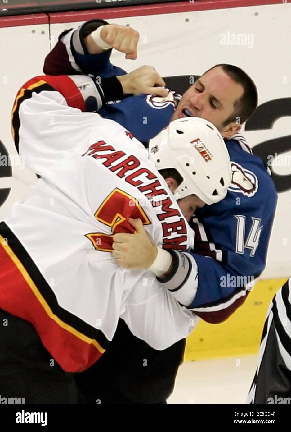 Calgary Flames defenseman Bryan Marchment (L) and Colorado Avalanche winger Ian Laperriere fight in the third period in Denver November 21, 2005. The Flames went on to win the game 3-2 scoring one goal in the shootout round. REUTERS/Rick Wilking Stock Photo