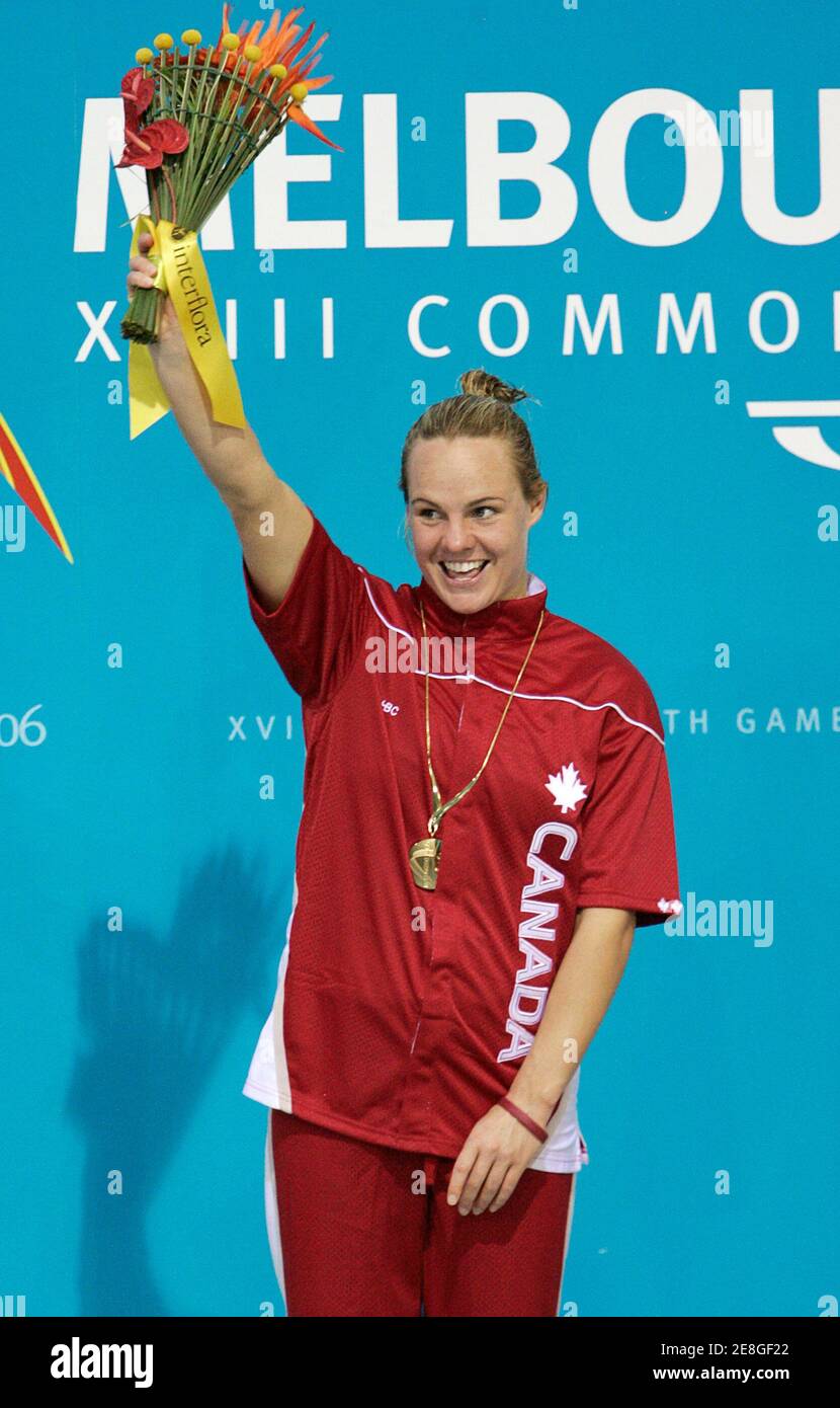 Canada's Blythe Hartley wears her gold medal during a ceremony at the Commonwealth Games in Melbourne, Australia March 24, 2006. Hartley won the gold in the women's 1M springboard diving competition.     REUTERS/Andy Clark Stock Photo