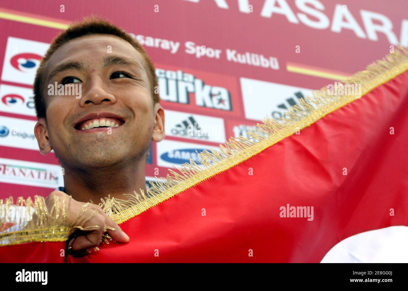 Junichi Inamoto Of Japan Smiles While Holding A Flag Of Turkish Soccer Champions Galatasaray In Istanbul September 1 06 Inamoto Former West Bromwich Albion Player Signed A One Year Contract With Turkish Champions Junichi Inamoto Of Japan Smiles While Holding A Flag Of Turkish Soccer Champions Galatasaray In Istanbul September 1 06 Inamoto Former West Bromwich Albion Player Signed A One Year Contract With Turkish Champions