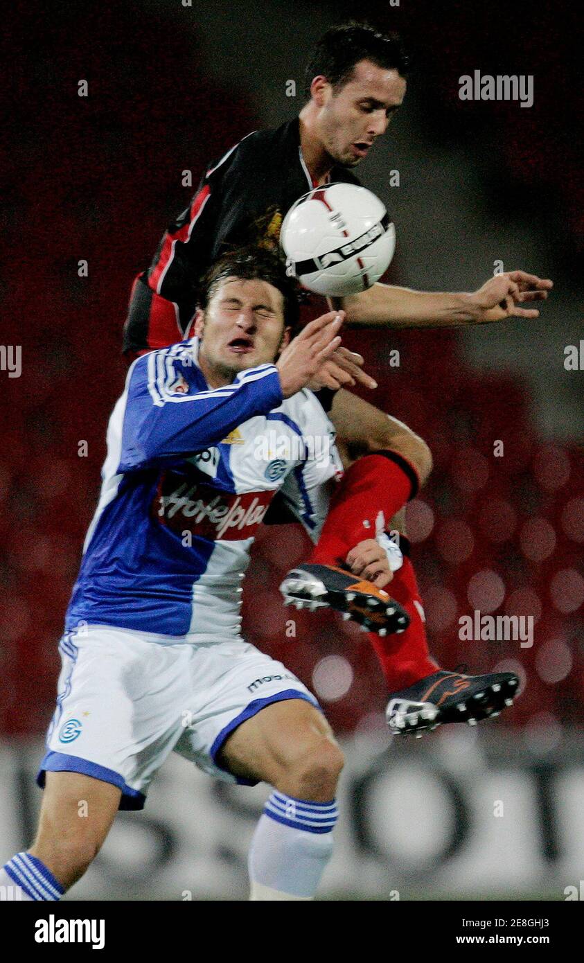 Neuchatel Xamax's Raphael Nuzzolo (top) fights for the ball with Grasshopper's (GC) Veroljub Salatic during their Swiss Super League soccer match in Neuchatel December 1, 2007. REUTERS/Pascal Lauener (SWITZERLAND) Stock Photo