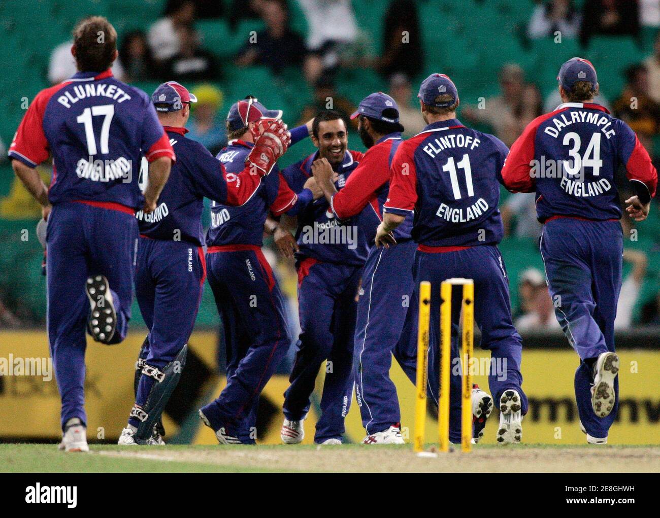 English players celebrate with team mate Ravinder Bopara (C, facing camera) after he dismissed Australia's Michael Hussey during their one-day international cricket match in Sydney February 2, 2007. REUTERS/Will Burgess (AUSTRALIA) Stock Photo