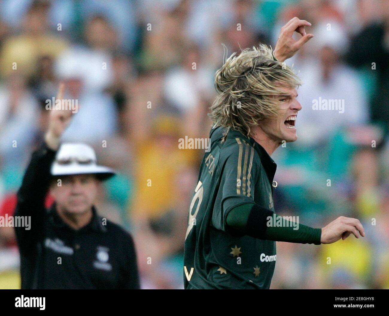 Australia's Nathan Bracken (R) reacts after dismissing England's Andre Strauss (not pictured) during their second one-day international tri-series cricket final at the Sydney Cricket Ground February 11, 2007. REUTERS/Will Burgess  (AUSTRALIA) Stock Photo