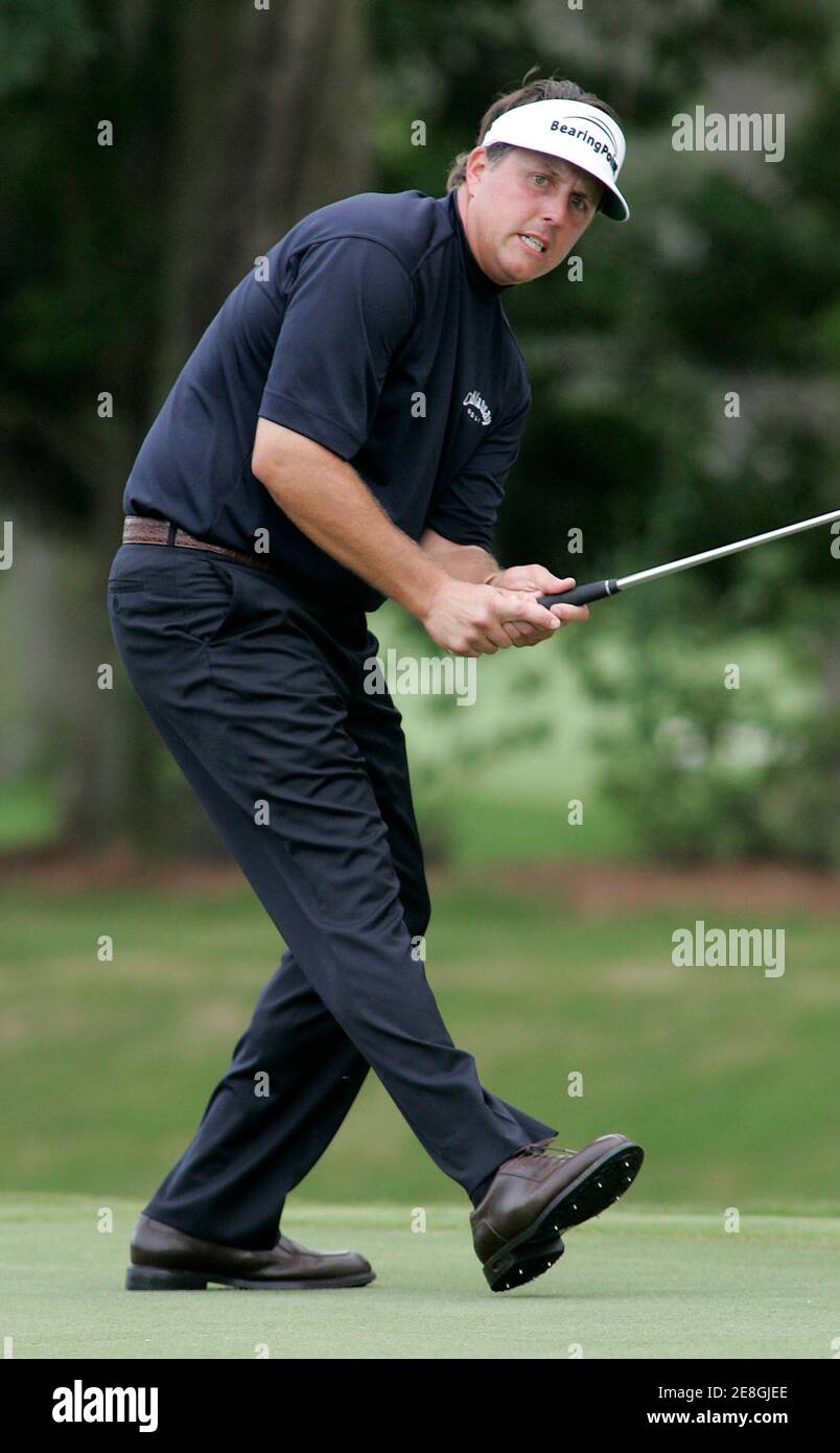 Phil Mickelson reacts after missing a putt on the ninth hole during the final round of play at The Players Championship golf tournament in Ponte Vedra Beach, Florida May 13, 2007. REUTERS/Rick Fowler (UNITED STATES) Stock Photo