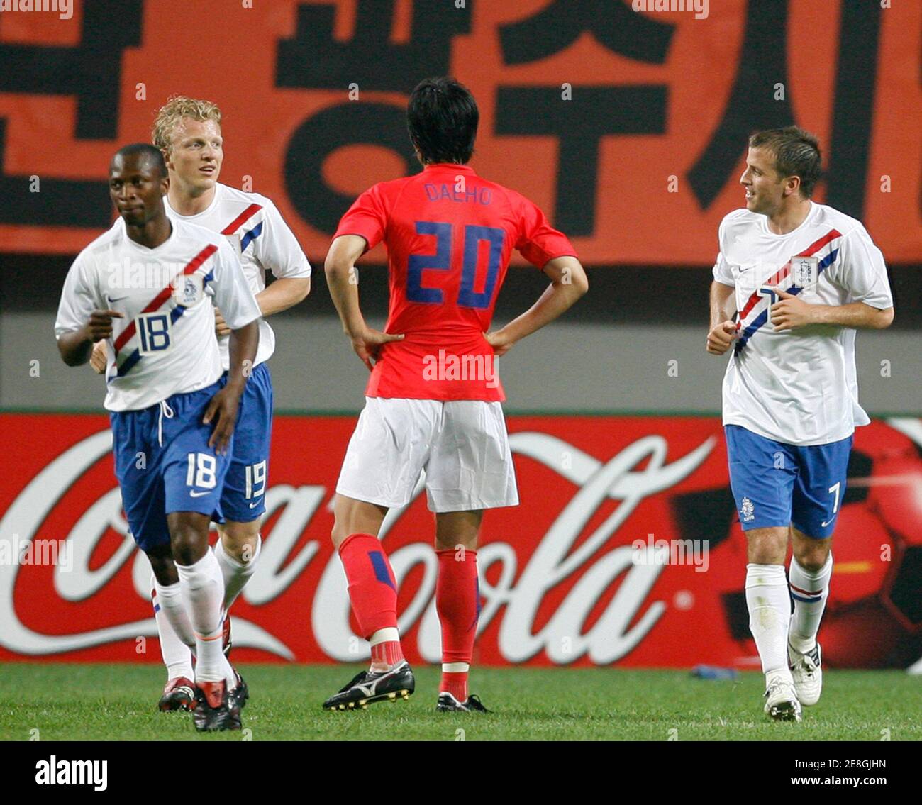 Rafael van der Vaart (R) of Netherlands celebrates with team mates Romeo Castelen (L) and Dirk Kuyt (2nd L) after his scoring second goal during their friendly soccer match with South Korea at the Seoul World Cup stadium in Seoul June 2, 2007.  REUTERS/Jo Yong-Hak (SOUTH KOREA) Stock Photo