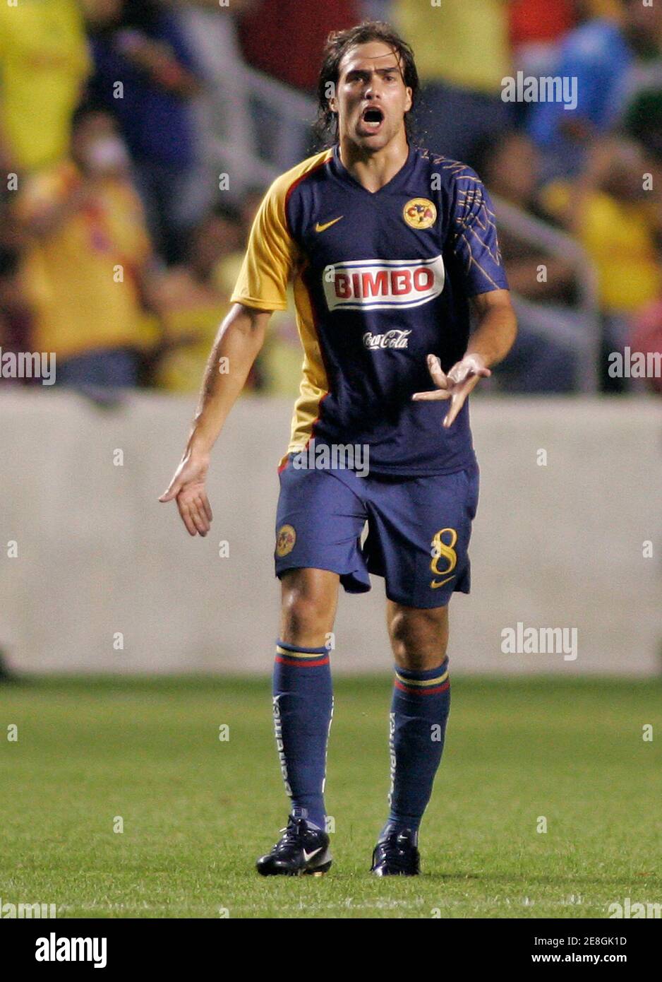 Club America midfielder Federico Insua (L) battles Monarcas Morelia  midfielder Adrian Aldrete for the ball during the second half of their  Supeliga Group B soccer match in Bridgeview, Illinois August 1, 2007.