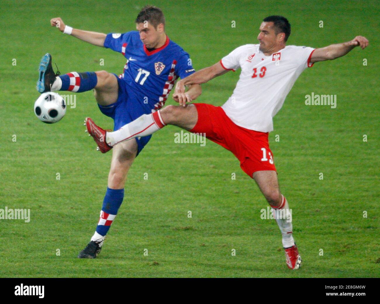 Poland's Rafal Murawski (R) challenges Croatia's Ivan Klasnic during their Group B Euro 2008 soccer match at the Woerthersee Stadium in Klagenfurt, June 16, 2008.  REUTERS/Miro Kuzmnovic (AUSTRIA)   MOBILE OUT. EDITORIAL USE ONLY Stock Photo