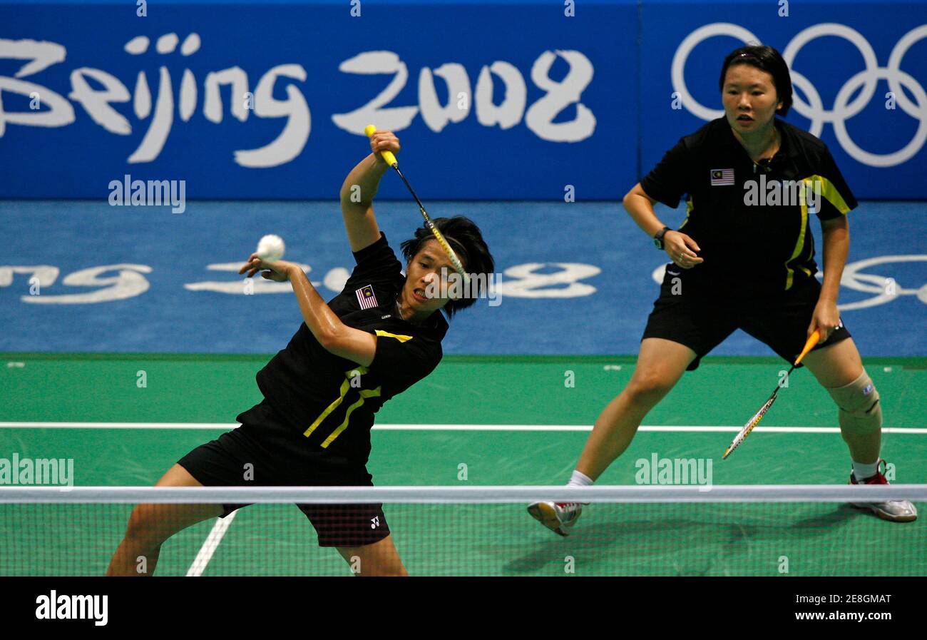 Chin Eei Hui of Malaysia watches as her compatriot Wong Pei Tty (L) hits a shot during their women's doubles round of 16 badminton match against South Korea at the Beijing 2008 Olympic Games, August 10, 2008.     REUTERS/Beawiharta (CHINA) Stock Photo