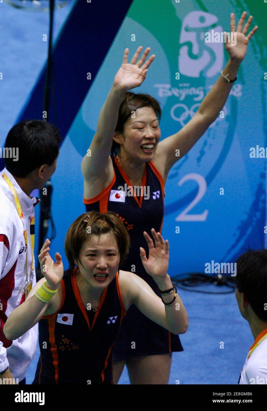 Miyuki Maeda (front) of Japan and her teammate Satoko Suetsuna wave after beating Yang Wei and Zhang Jiewen of China in their women's doubles quarter-final badminton match at the Beijing 2008 Olympic Games, August 11, 2008.     REUTERS/Beawiharta (CHINA) Stock Photo