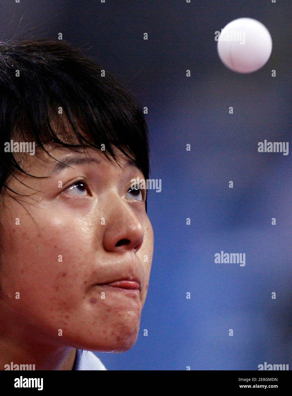 Huang I-hwa of Taiwan eyes the ball during his men's singles first round table tennis match against Andrea Bakula of Croatia at the Beijing 2008 Olympic Games August 19, 2008.     REUTERS/Beawiharta (CHINA) Stock Photo