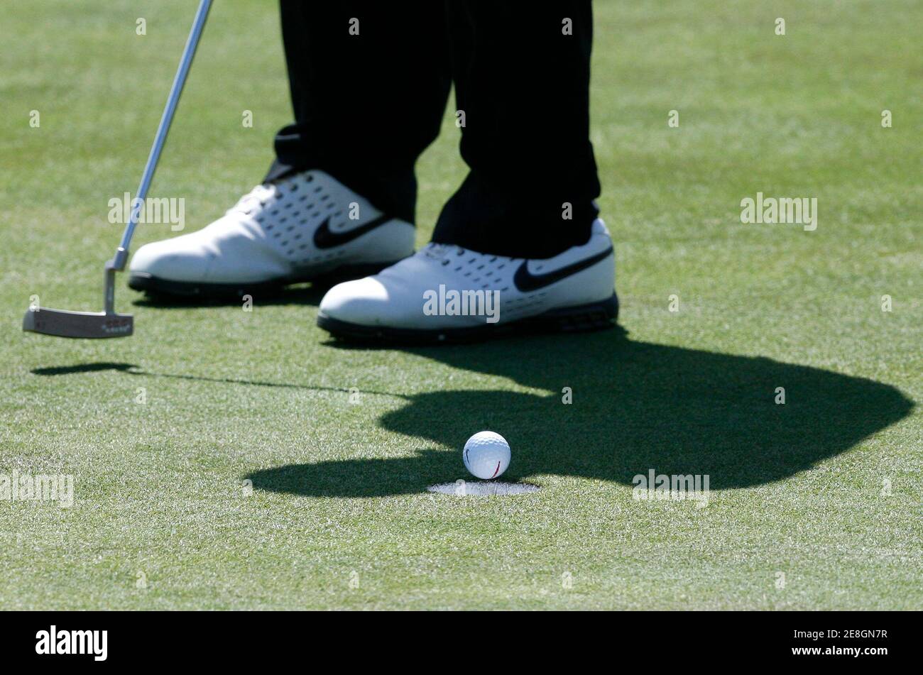 Anthony Kim of the U.S. makes a par putt on the 17th green during the second round of Ballantine's Championship golf tournament at the Pinx Golf Club in Seogwipo on Jeju Island March 14, 2008.  REUTERS/Jo Yong-Hak (SOUTH KOREA) Stock Photo