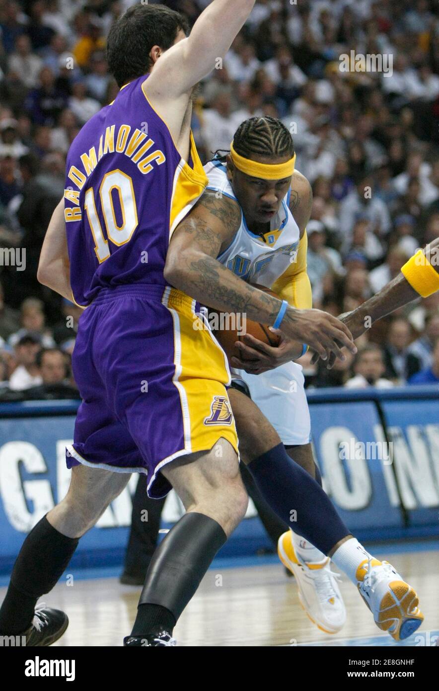 Denver Nuggets Carmelo Anthony (R) drives past Los Angeles Lakers Vladmir Radmanovic during the first quarter of Game 3 of their NBA playoff series in Denver, Colorado, April 26, 2008. REUTERS/Rick Wilking (UNITED STATES) Stock Photo