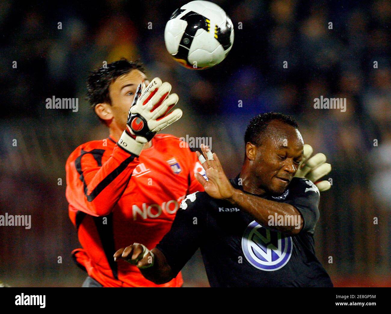 Olympique Lyon's goalkeeper Hugo Lloris (L) jumps for the ball with Partizan's Almami Moreira during their friendly soccer match in Belgrade July 23, 2008.  REUTERS/Ivan Milutinovic  (SERBIA) Stock Photo
