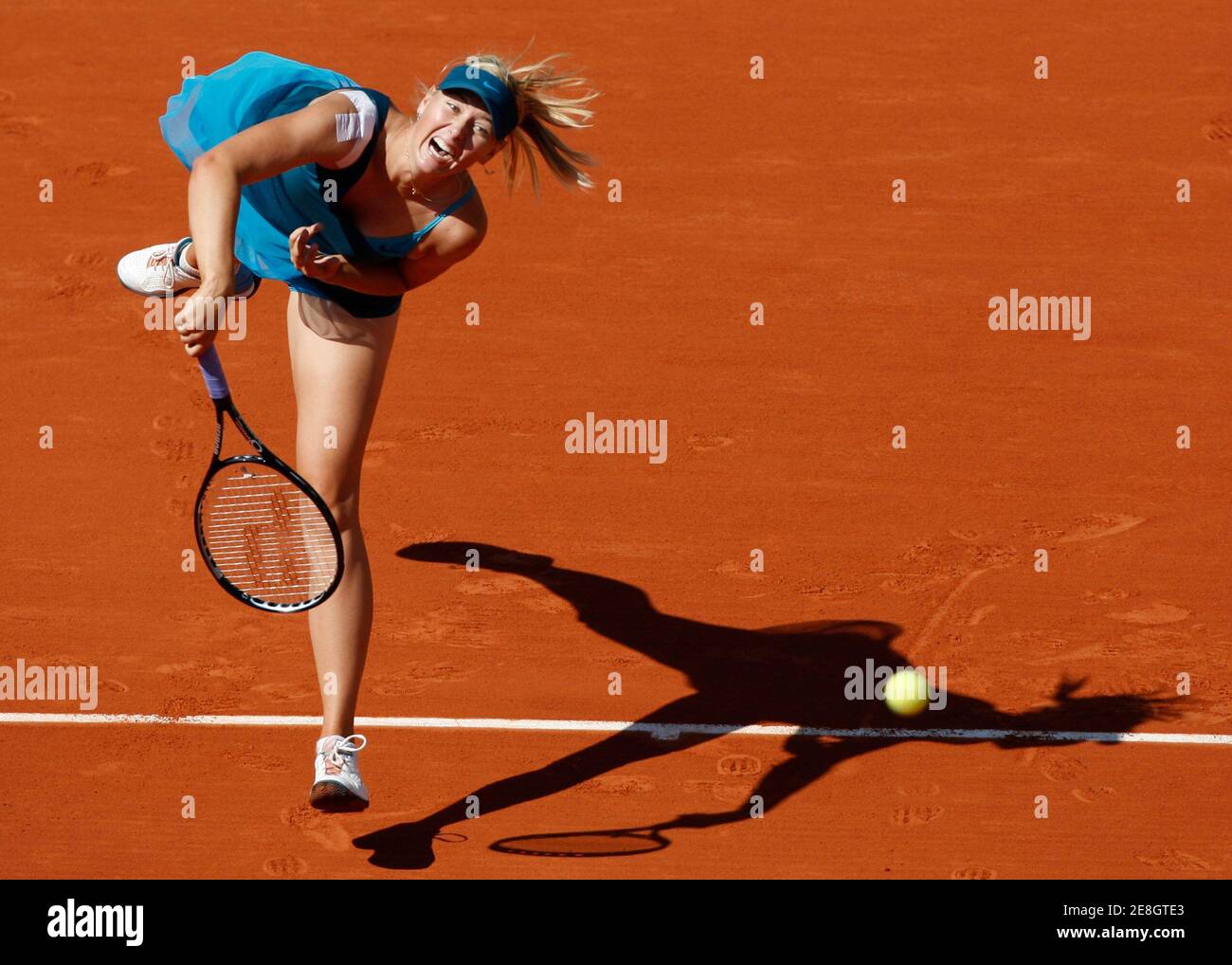 Maria Sharapova of Russia serves to Dominika Cibulkova of Slovakia during  their quarter-final match at the French Open tennis tournament at Roland  Garros in Paris June 2, 2009. REUTERS/Vincent Kessler (FRANCE SPORT
