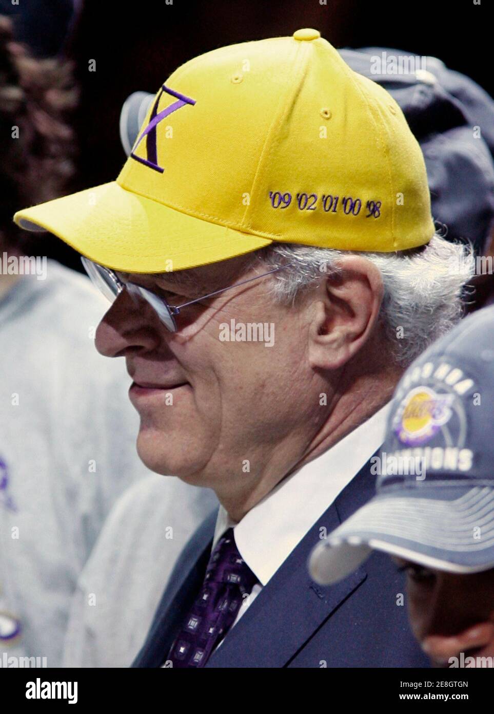 Los Angeles Lakers head coach Phil Jackson wears a hat made by his kids to  signify his record breaking 10th NBA Championship after his team defeated  the Orlando Magic in Game 5