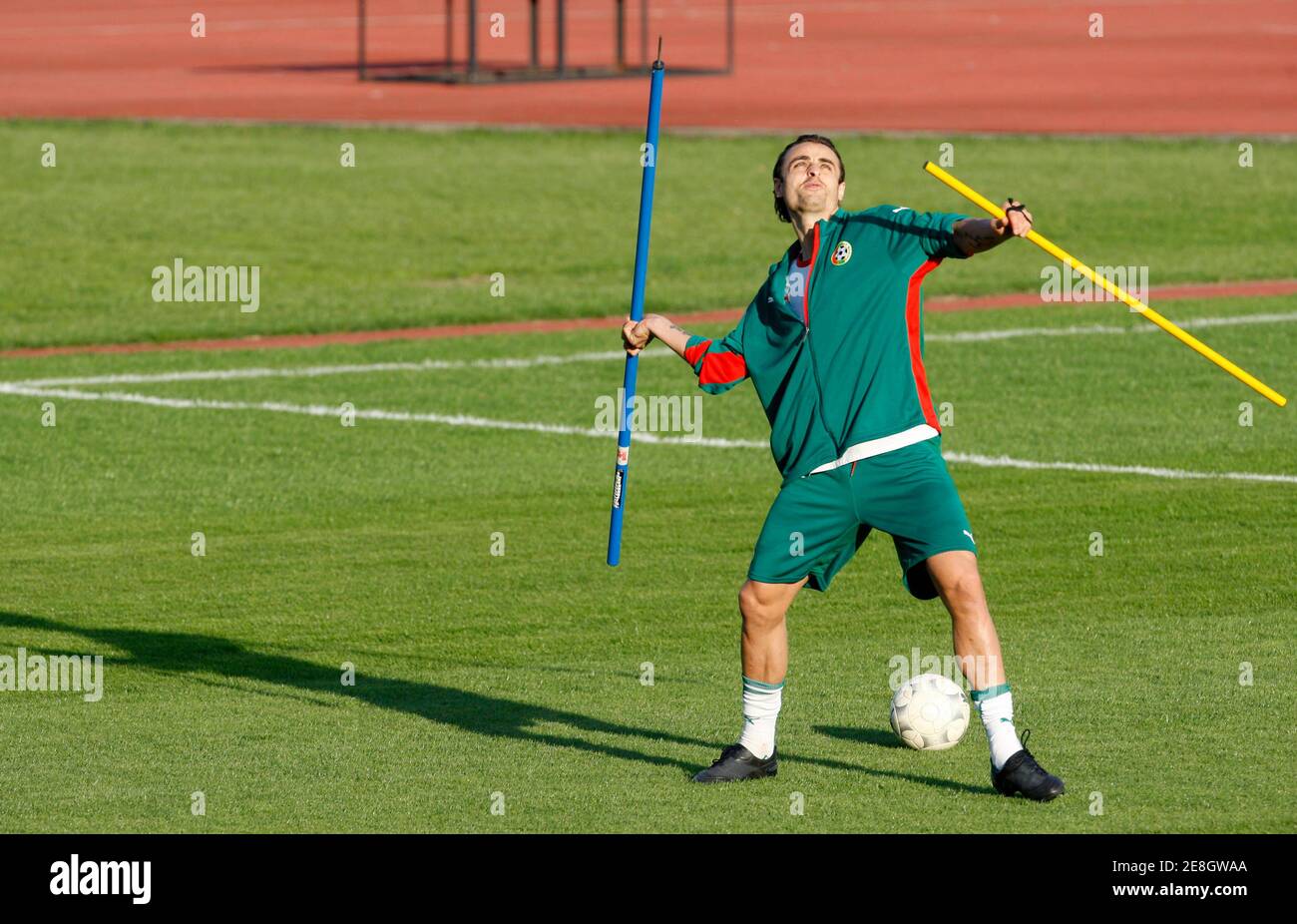 Captain of the Bulgarian national soccer team Dimitar Berbatov throws a wooden stick during team's practice at Vassil Levski stadium in Sofia, October 6, 2009. Bulgaria will meet Cyprus on Saturday and Georgia on Wednesday for their World Cup 2010 qualification matches.   REUTERS/Oleg Popov   (BULGARIA SPORT SOCCER) Stock Photo