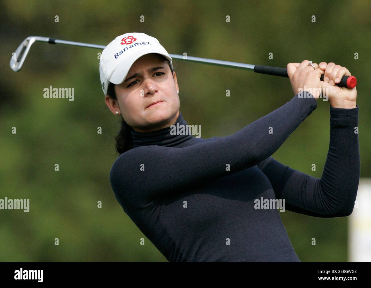 Lorena Ochoa of Mexico tees off at the 3rd hole during the first round of the LPGA HanaBank-Kolon Championship golf tournament at Sky72 Golf Club Ocean course in Incheon, west of Seoul, October 30, 2009.  REUTERS/Jo Yong-Hak (SOUTH KOREA SPORT GOLF) Stock Photo