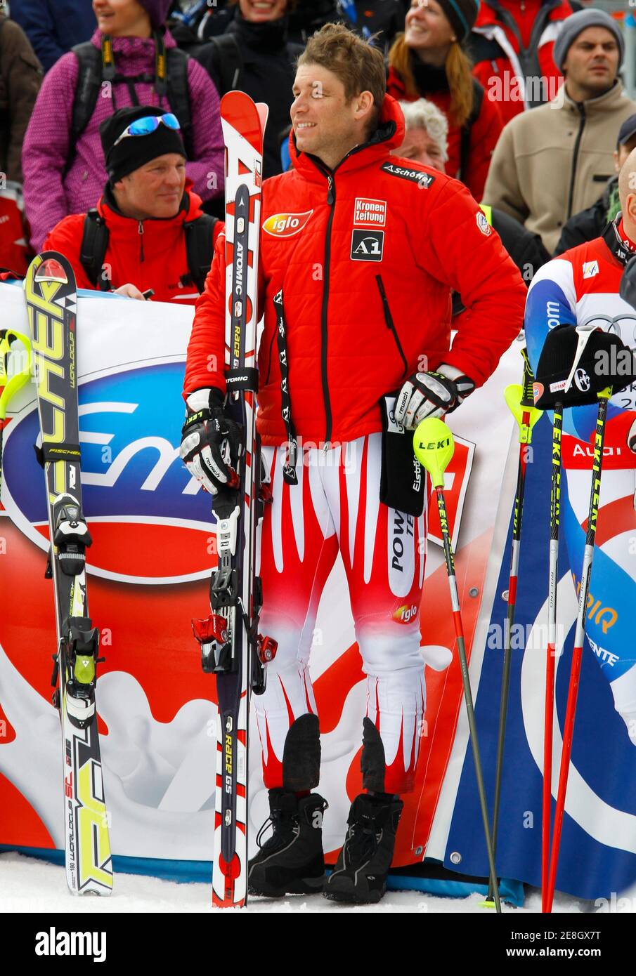 Benjamin Raich of Austria smiles during the podium ceremony after the season's last races in Garmisch-Partenkirchen March 13, 2010. REUTERS/Wolfgang Rattay (GERMANY - Tags: SPORT SKIING) Stock Photo