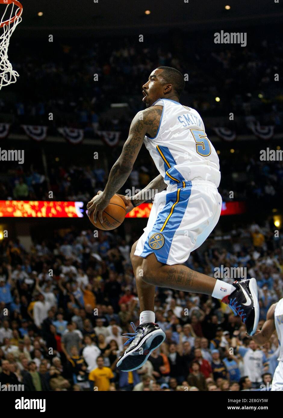 Denver Nuggets guard J.R.Smith flies toward the hoop before he stuffed a basket against the Utah Jazz in the fourth quarter in Game 6 of their NBA Western Conference playoff series in Denver April 28, 2010. REUTERS/Rick Wilking (UNITED STATES - Tags: SPORT BASKETBALL) Stock Photo