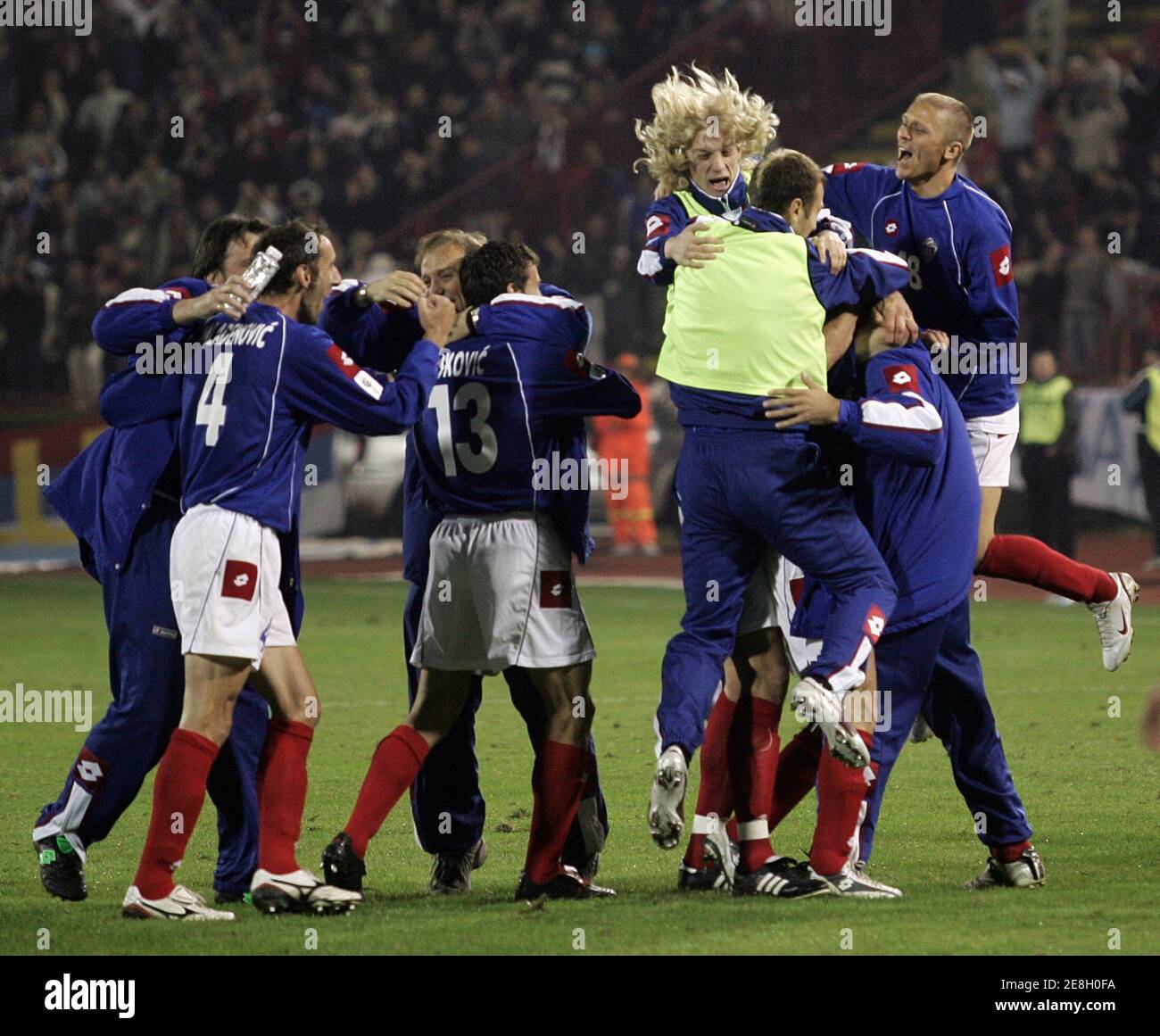 Serbia and Montenegro's players celebrate their win over Bosnia after their World Cup 2006 qualifying soccer match in Belgrade October 12, 2005. REUTERS/Ivan Milutinovic Stock Photo