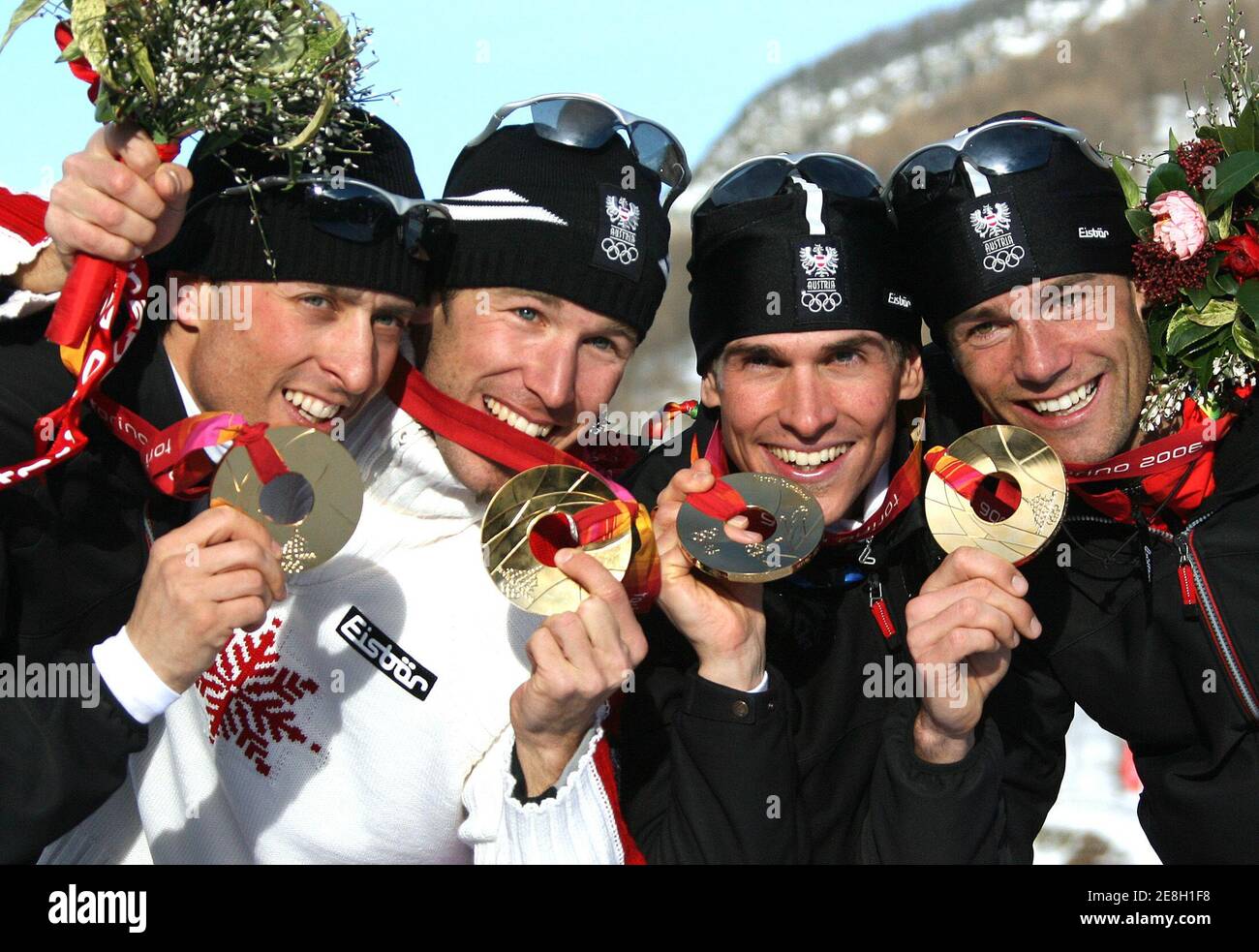 Austria's Mario Stecher, Christoph Bieler, Felix Gottwald and Michael Gruber (L-R) present their gold medals after winning the Nordic combined team competition at the Torino 2006 Winter Olympic Games in Pragelato, Italy, February 16, 2006. Austria won the competition ahead of Germany and Finland.  REUTERS/Pascal Lauener Stock Photo