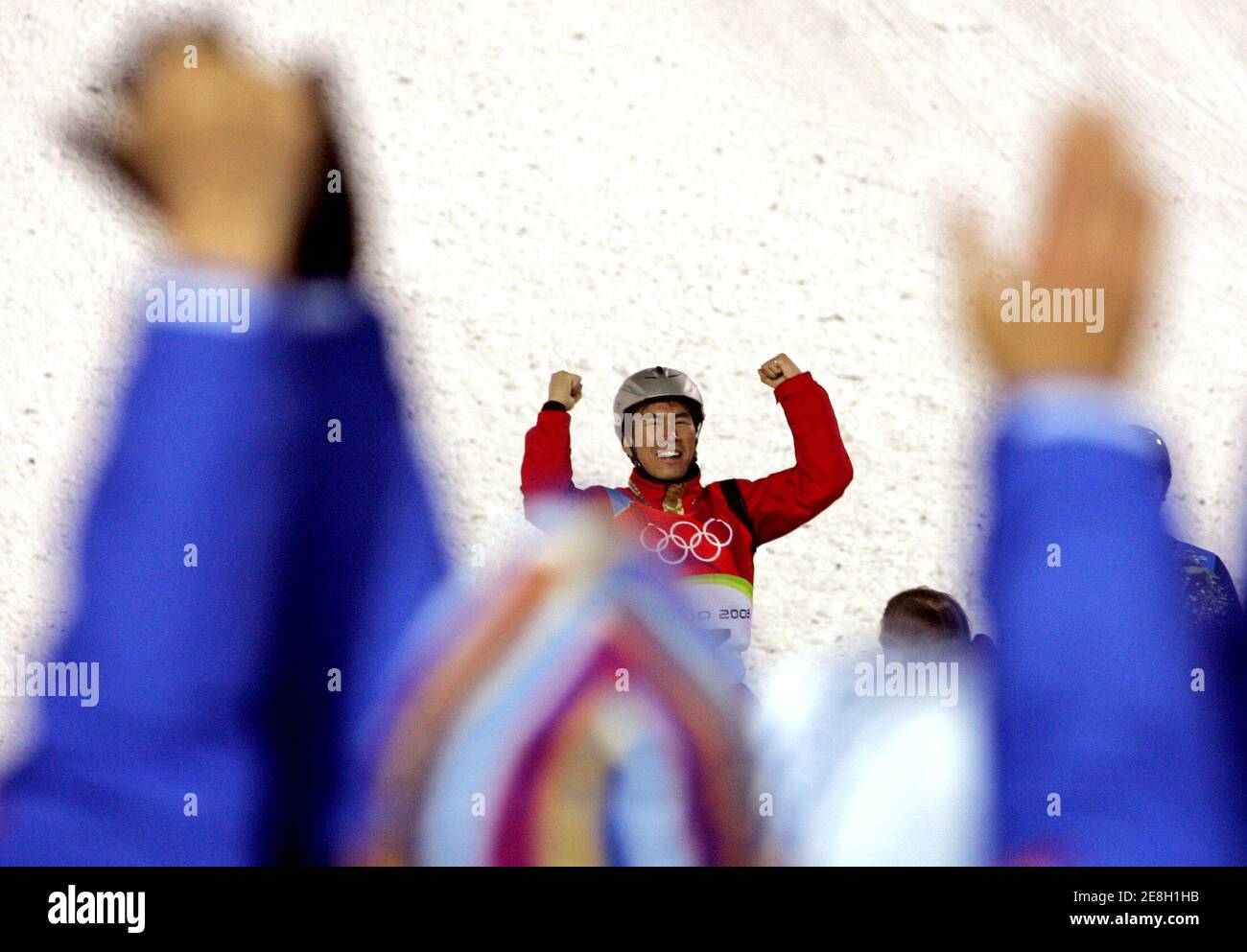 Han Xiaopeng of China celebrates during the final of the men's aerials freestyle competition at the Torino 2006 Winter Olympic Games in Sauze d?Oulx, Italy February 23, 2006.     REUTERS/Pascal Lauener Stock Photo