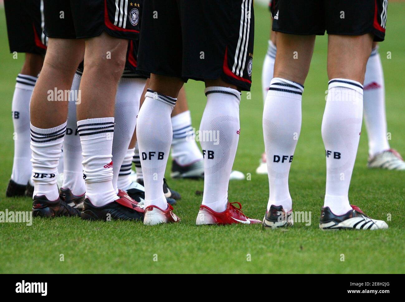 Players wearing Nike and Adidas shoes stand together during a German  national soccer team training session in the southern German city of  Stuttgart September 1, 2006. Germany will face Ireland for their