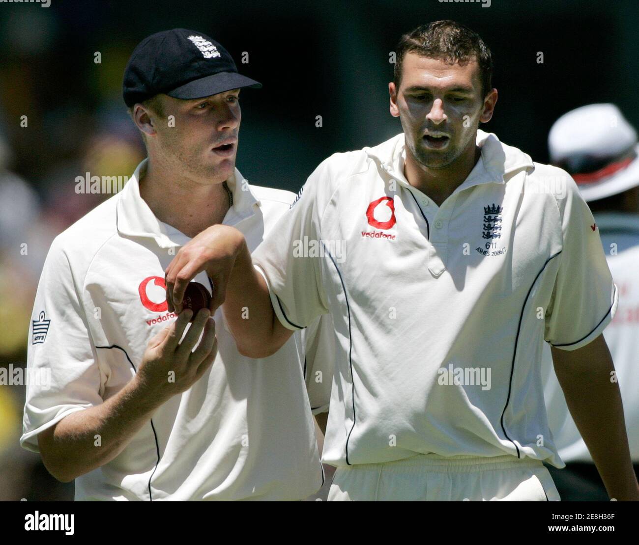 England's captain Andrew Flintoff (L) has a word with pace bowler Steve Harmison before Harmison's opening spell on the first day of the third Ashes cricket test against Australia in Perth December 14, 2006. Australia lead the best-of-five series 2-0. MOBILES OUT, EDITORIAL USE ONLY REUTERS/Will Burgess  (AUSTRALIA) Stock Photo