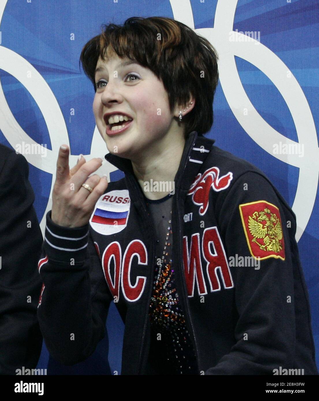Irina Slutskaya from Russia reacts after the women's short program during the Figure Skating competition at the Torino 2006 Winter Olympic Games in Turin, Italy, February 21, 2006. REUTERS/Andy Clark Stock Photo