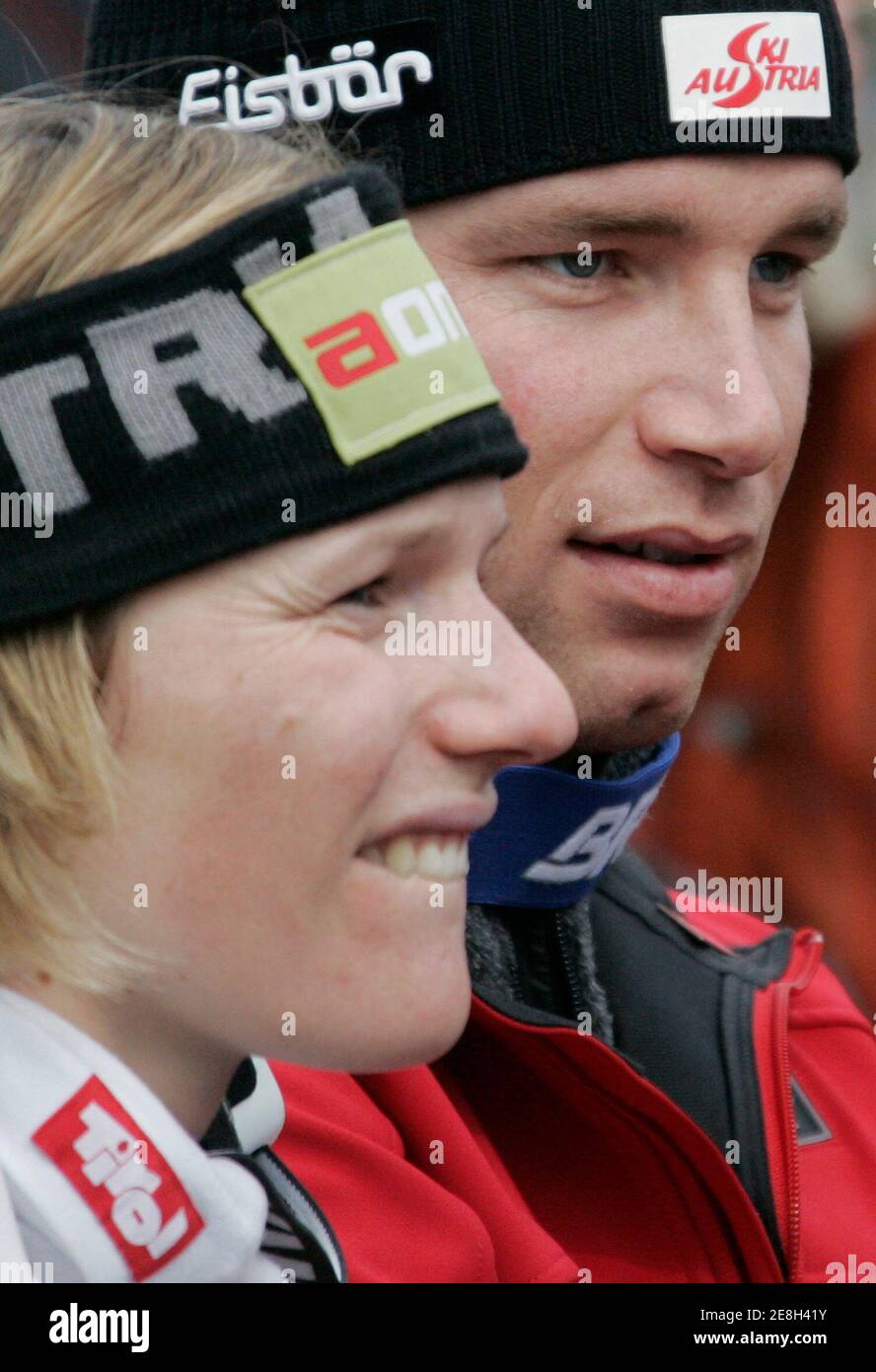 Marlies Schild of Austria (L) and Benjamin Raich of Austria wait before the prize-giving ceremony in the finish area after the season's last men's giant slalom race at the Alpine Ski World Cup Finals in Lenzerheide March 17, 2007. REUTERS/Pascal Lauener (SWITZERLAND) Stock Photo