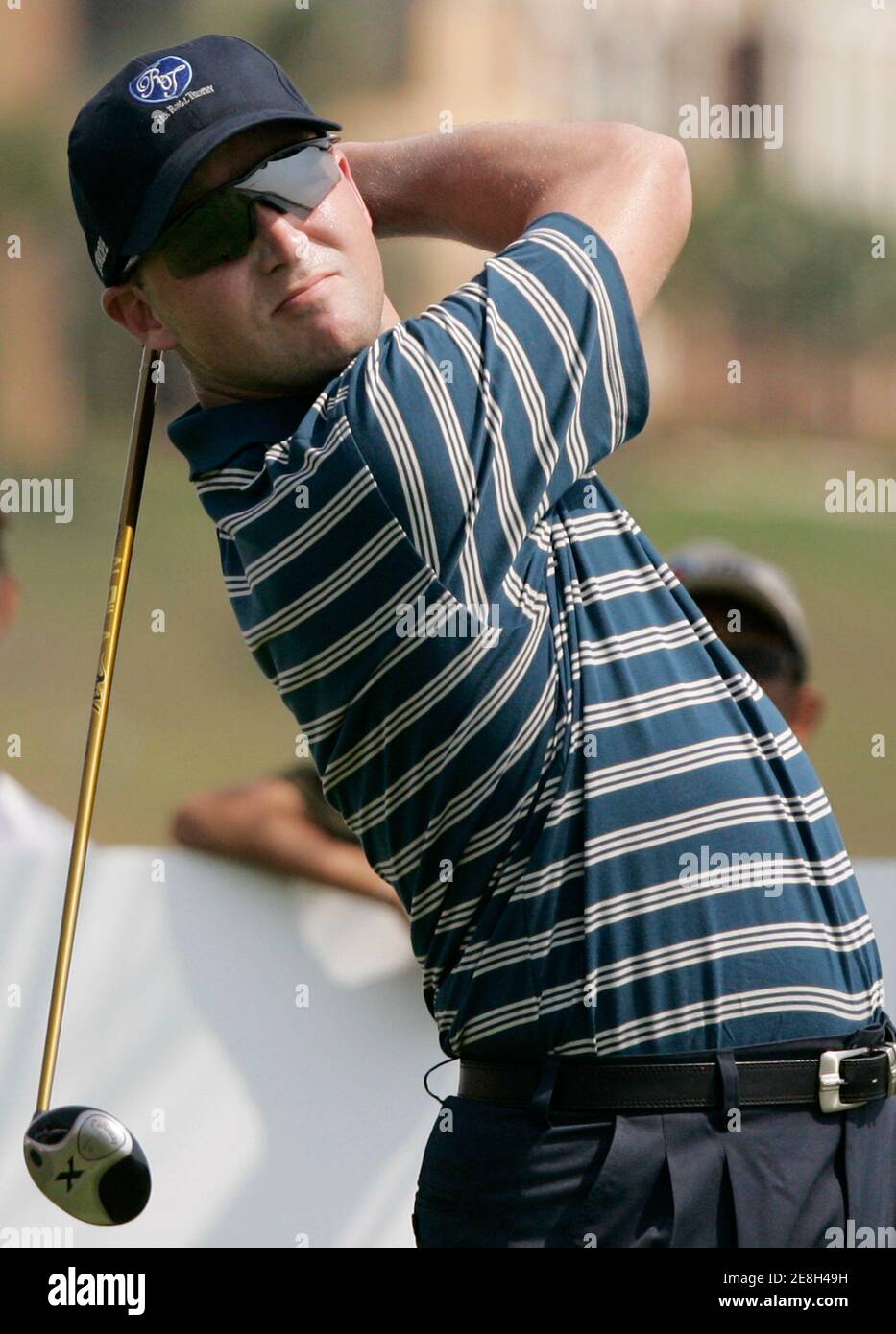 Niclas Fasth of Sweden tees off on the 3rd hole during the four-ball match of the Royal Trophy Europe vs Asia Golf Championship at Amata Spring Country Club on the outskirts of Bangkok January 13, 2007. REUTERS/Chaiwat Subprasom (THAILAND) Stock Photo