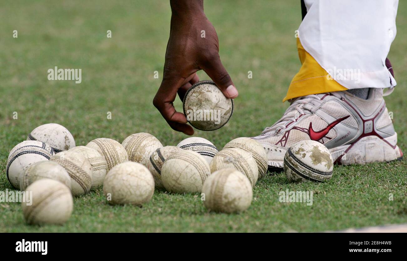 West Indies' Corey Collymore picks up a cricket ball during training for the World Cup cricket Super Eights in Georgetown March 31, 2007.   MOBILES OUT, EDITORIAL USE ONLY   REUTERS/Andy Clark   (GUYANA) Stock Photo