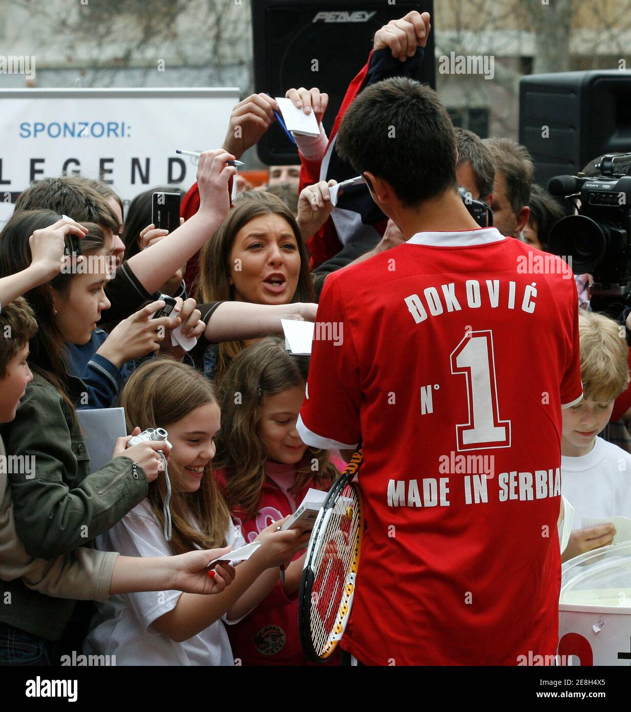 Serbia's tennis player Novak Djokovic signs autographs at an exhibition tennis match in the center of Belgrade April 4, 2007. Djokovic will be playing a Davis Cup match against Georgia on April 6, 2007. Djokovic became very popular in Serbia after victory at the Sony Ericsson Open tennis tournament in Key Biscayne earlier this month. REUTERS/Ivan Milutinovic (SERBIA) Stock Photo