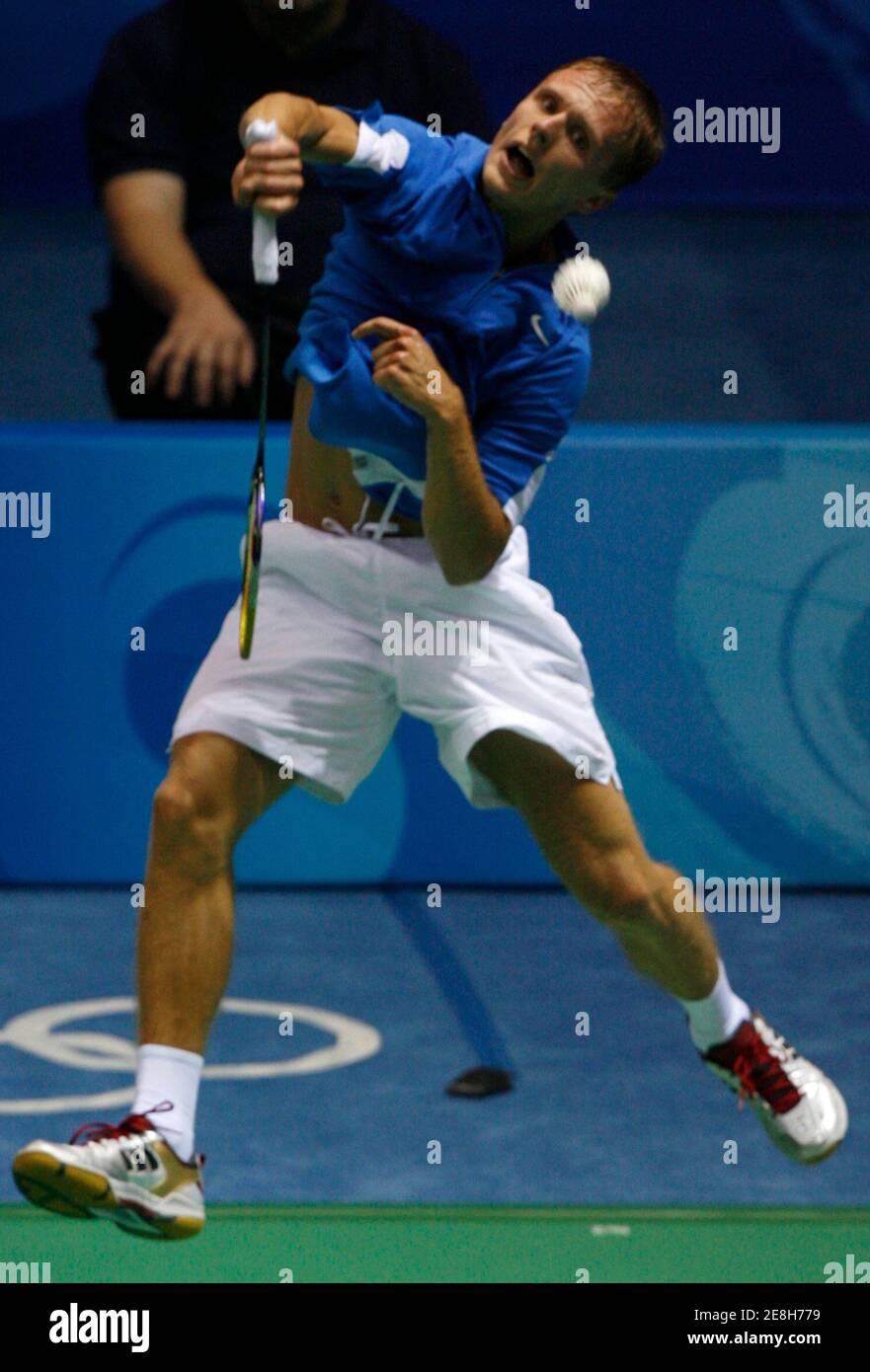 Raul Must of Estonia plays a shot to Przemyslaw Wacha of Poland during his men's singles first round badminton match at the Beijing 2008 Olympic Games August 9, 2008.   REUTERS/Beawiharta (CHINA) Stock Photo