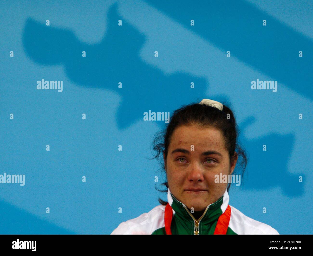 Bronze medallist Nastassia Novikava of Belarus reacts during the medal ceremony for the women's 53kg weightlifting competition at the Beijing 2008 Olympic Games August 10, 2008.     REUTERS/Oleg Popov (CHINA) Stock Photo