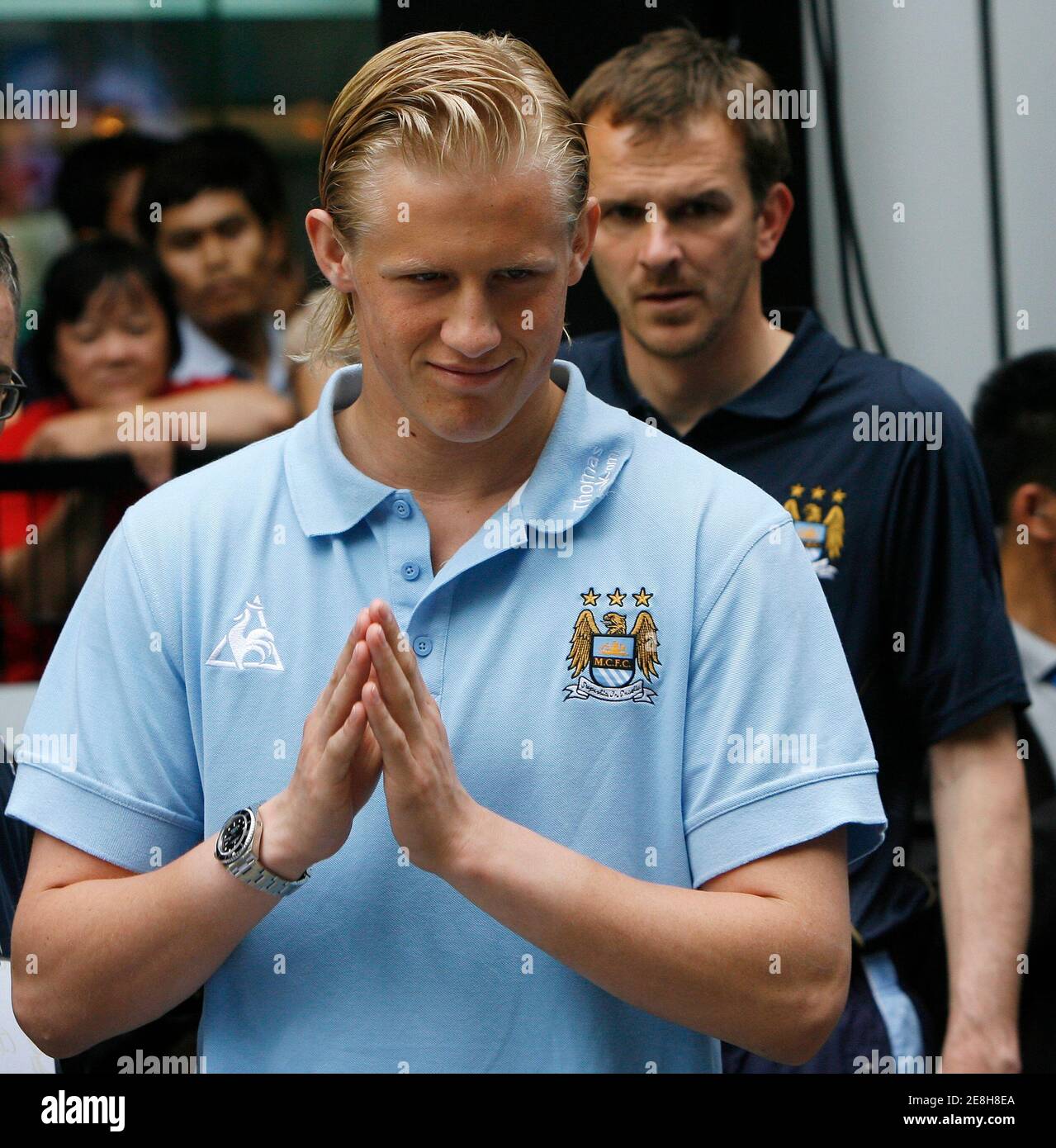 Manchester City goalkeeper Kasper Schmeichel and his teammate Dietmar Hamann attend a news conference at a shopping mall in Bangkok May 15, 2008. Manchester City will play a soccer friendly against Thailand on May 17. REUTERS/Chaiwat Subprasom (THAILAND) Stock Photo