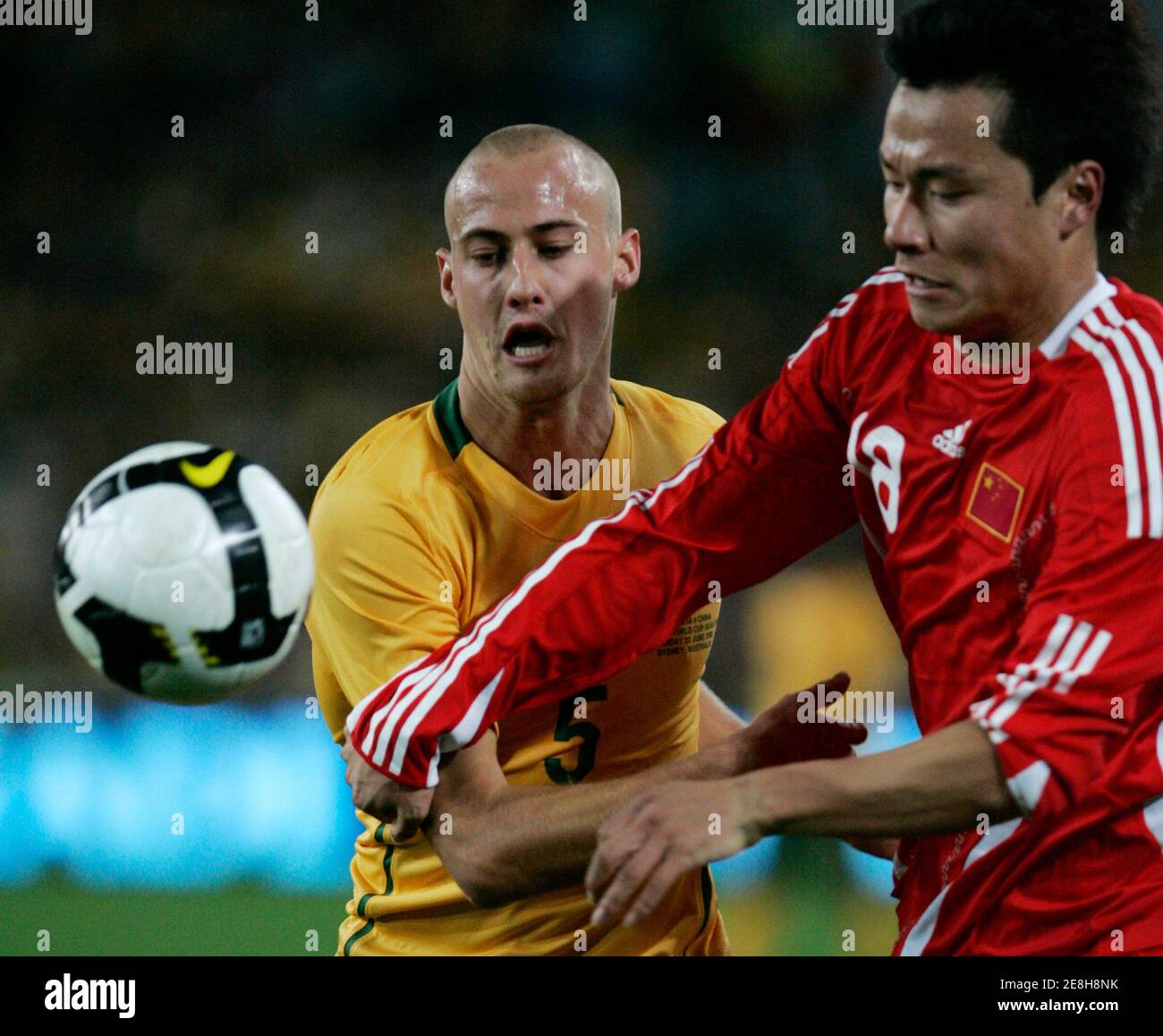 China's Gao Lin (R) battles for the ball against Australia's Ruben Zadkovich during their 2010 FIFA World Cup qualifier soccer match in Sydney June 22, 2008. REUTERS/Will Burgess (AUSTRALIA) Stock Photo