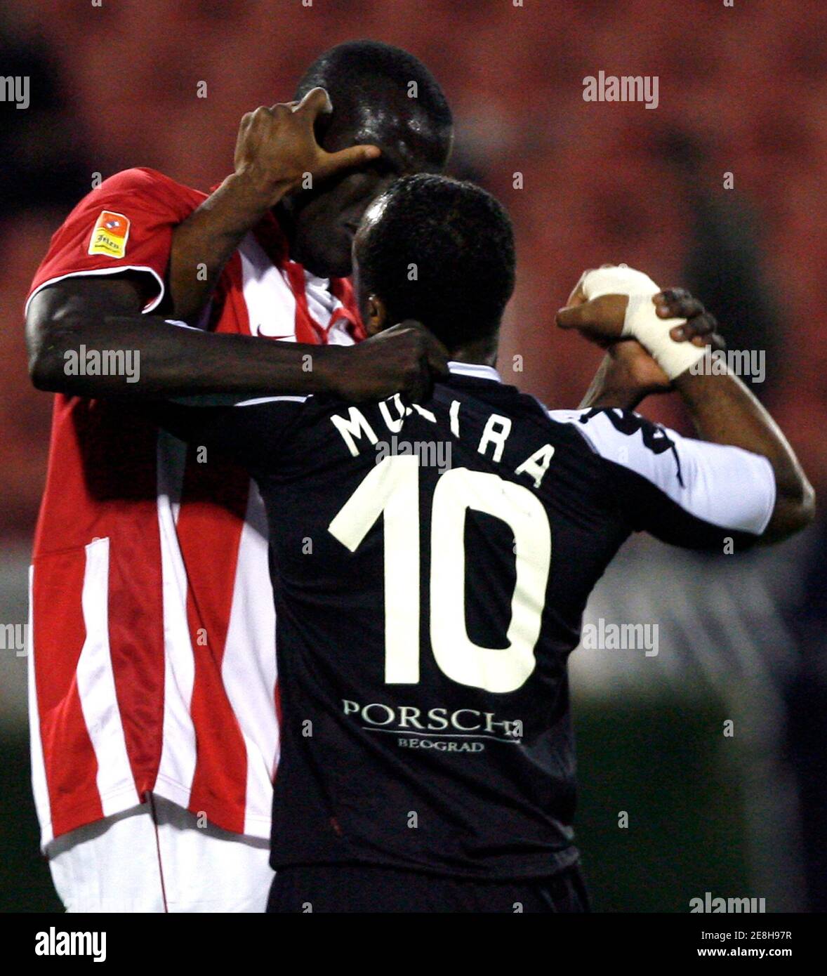 Red Star's Ibrahima Gueye (L) scuffles with Partizan's Almani Moreira during their Serbia first division derby soccer match in Belgrade October 5, 2008.  REUTERS/Ivan Milutinovic  (SERBIA) Stock Photo