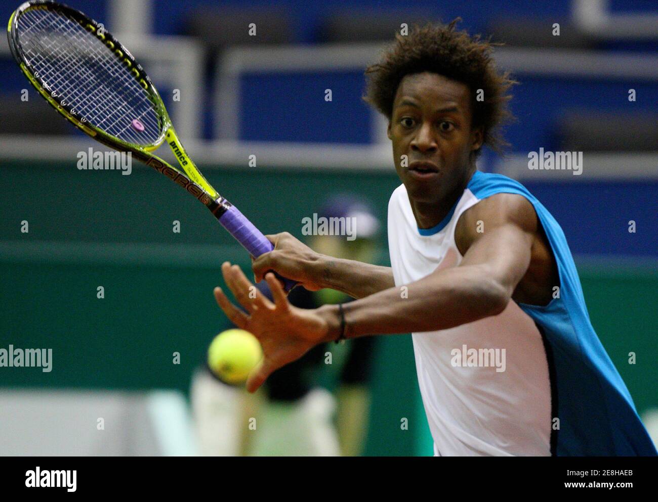 Gael Monfils of France eyes the ball during his tennis match against  Stephane Bohli of Switzerland at World Indoor Tournament in Rotterdam  February 10, 2009. REUTERS/Michael Kooren (NETHERLANDS Stock Photo - Alamy