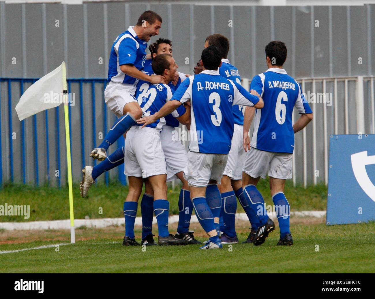 Sportist Svoge's players celebrate the first goal of Todor Simov (C, obscured) against Levski Sofia during their Bulgarian League soccer match at the town of Svoge, some 55 km north of Sofia, October 25, 2009.   REUTERS/Oleg Popov   (BULGARIA SPORT SOCCER) Stock Photo