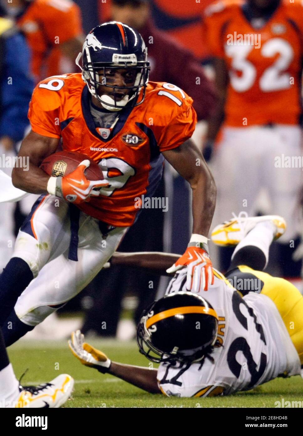 Denver Broncos wide receiver Eddie Royal (L) eludes a tackle by Pittsburgh Steelers cornerback William Gay in the first quarter of their NFL football game in Denver November 9, 2009. REUTERS/Rick Wilking (UNITED STATES SPORT FOOTBALL) Stock Photo