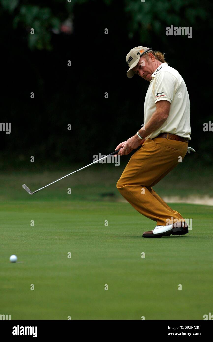 Miguel Angel Jimenez of Spain reacts after missing a putt on the 18th green during the third round of the Hong Kong Open golf tournament November 14, 2009.  REUTERS/Tyrone Siu    (CHINA SPORT GOLF) Stock Photo