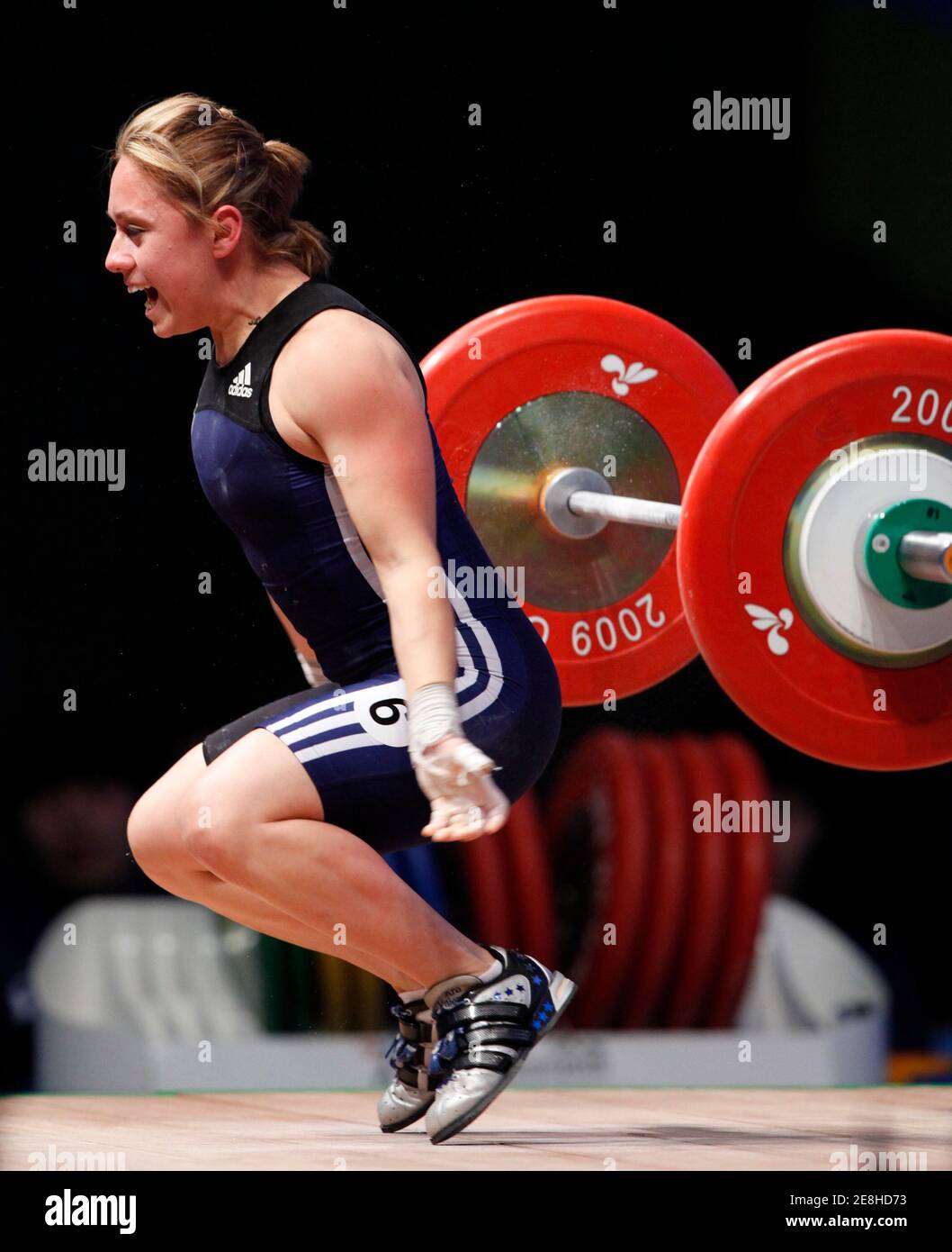 Mexico's Carolina Valencia reacts as she makes an unsuccessful attempt in the women's 48kg Group A snatch competition at the World Weightlifting Championship in Goyang, north of Seoul, November 21, 2009.  REUTERS/Jo Yong-Hak (SOUTH KOREA SPORT WEIGHTLIFTING) Stock Photo