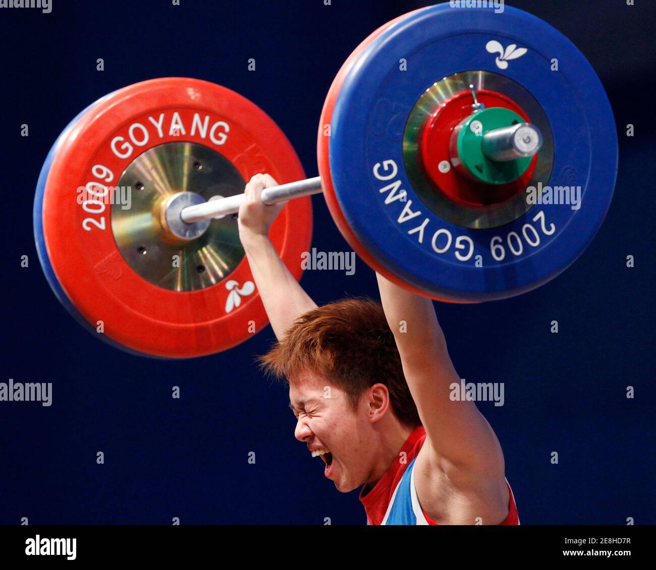Lin Wan-hsuan of Taiwan competes in the women's 58kg Group A weightlifting clean and jerk competition at the World Weightlifting Championship in Goyang, north of Seoul, November 23, 2009.  REUTERS/Jo Yong-Hak (SOUTH KOREA SPORT WEIGHTLIFTING) Stock Photo