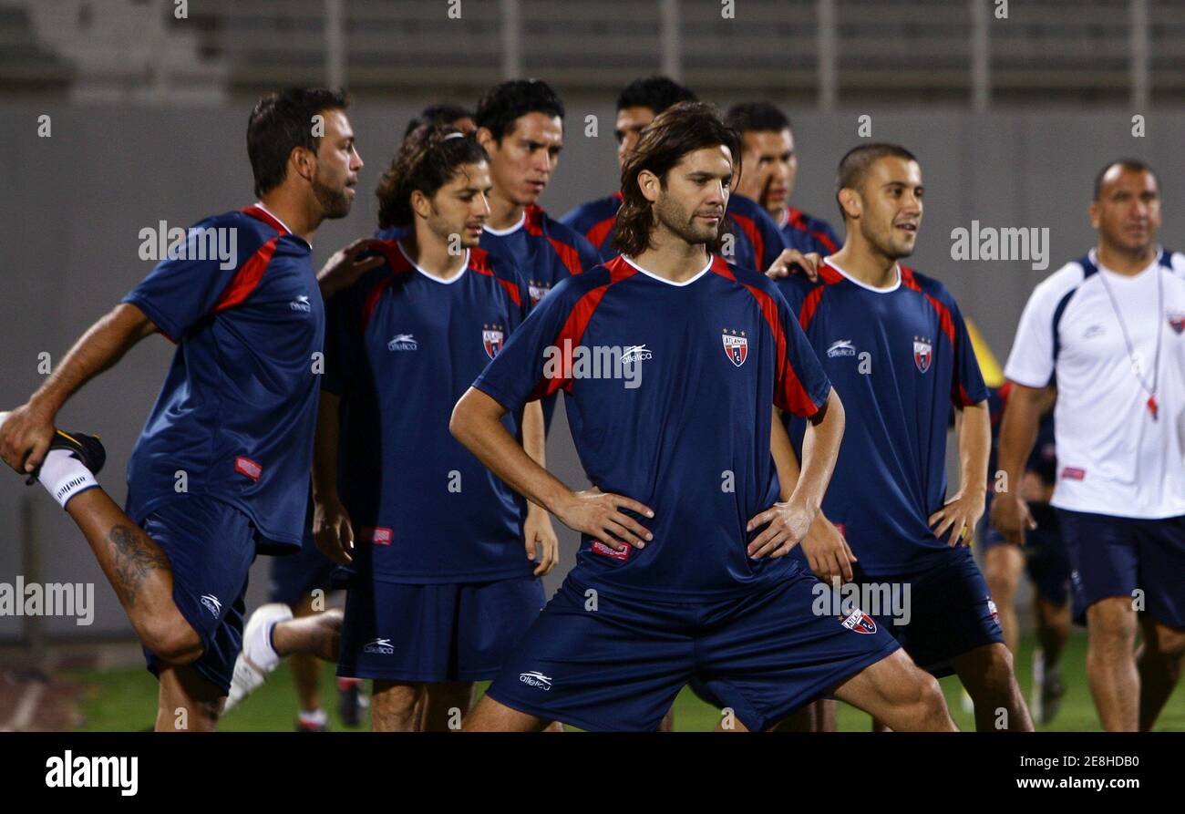 Members of the Atlante soccer team stretch during a training session at Al Nahyan stadium in Abu Dhabi December 10, 2009. Mexico's Atlante will play Auckland City on Saturday during the FIFA Club World Cup soccer tournament in Abu Dhabi. REUTERS/Fahad Shadeed (UNITED ARAB EMIRATES SPORT SOCCER) Stock Photo