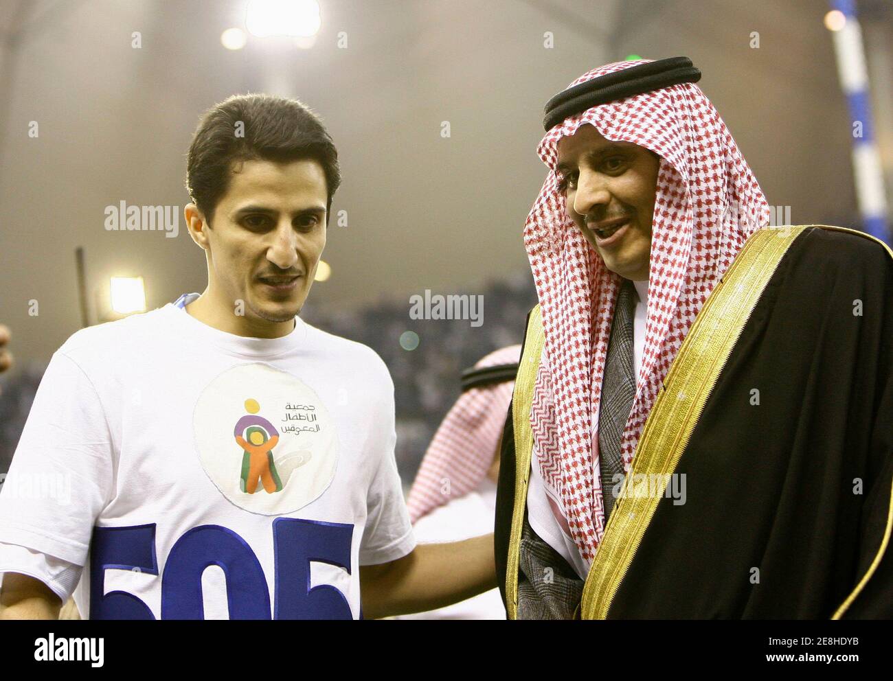 Saudi Prince Sultan Bin Fahad (R) greets Saudi Arabian club Al Hilal's Nawaf Al-Temyat before the match with Inter Milan in Riyadh Januray 2, 2010. Inter Milan are in Riyadh to play against Saudi club Al Hilal in a testimonial match for veteran Saudi soccer player Nawaf Al-Temyat.  REUTERS/Fahad Shadeed    (SAUDI ARABIA - Tags: SPORT SOCCER) Stock Photo